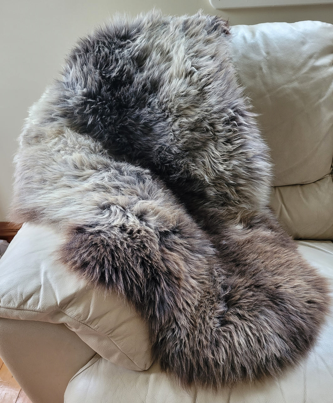 Naturally beautiful - undyed sheepskin rug.  shades of black/grey/brown 90cm