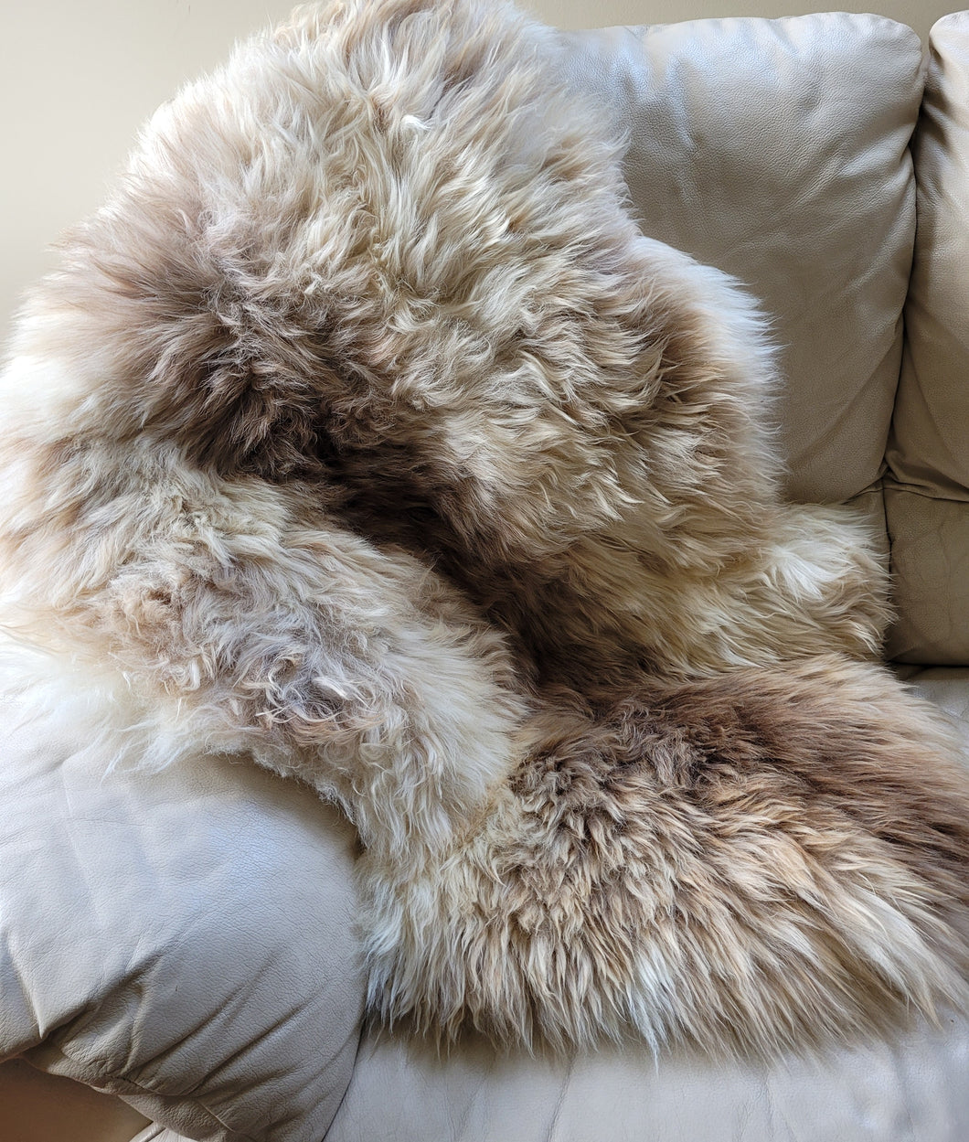 Naturally beautiful - undyed sheepskin rug.  shades of ivory/brown  95cm