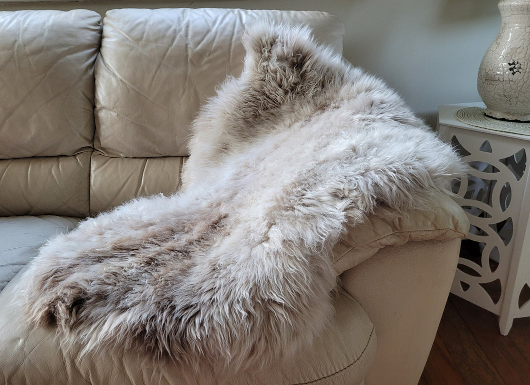 Naturally beautiful - undyed sheepskin rug.  shades of iwhite/grey  95cm