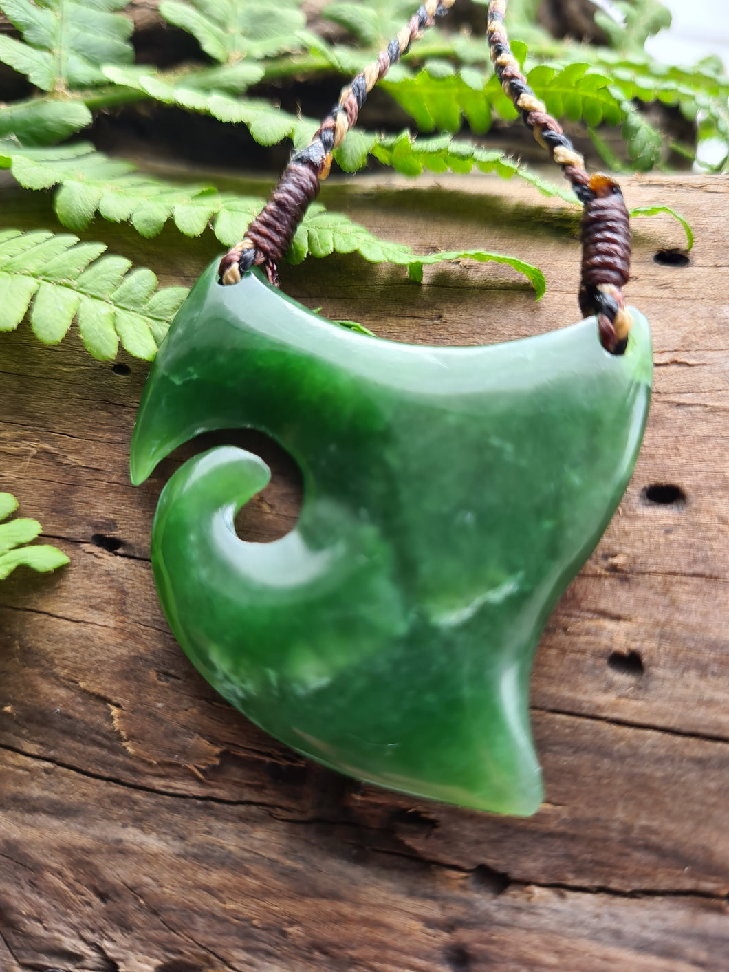 Koru Shield NZ greenstone hand carved pendant. symbolises new life, strength protection