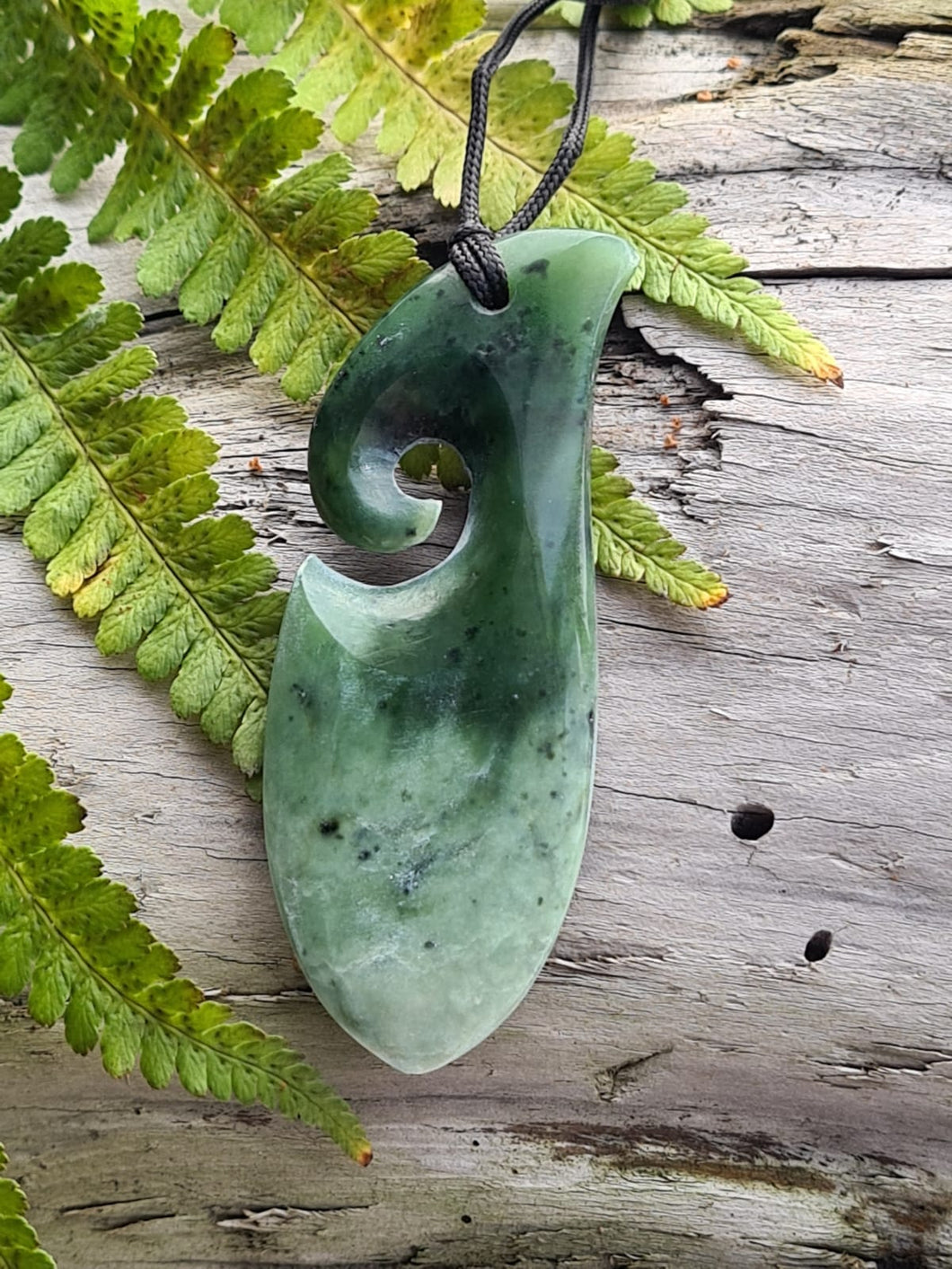 Koru Teardrop NZ greenstone hand carved pendant. Symbolises strength, safe travel.